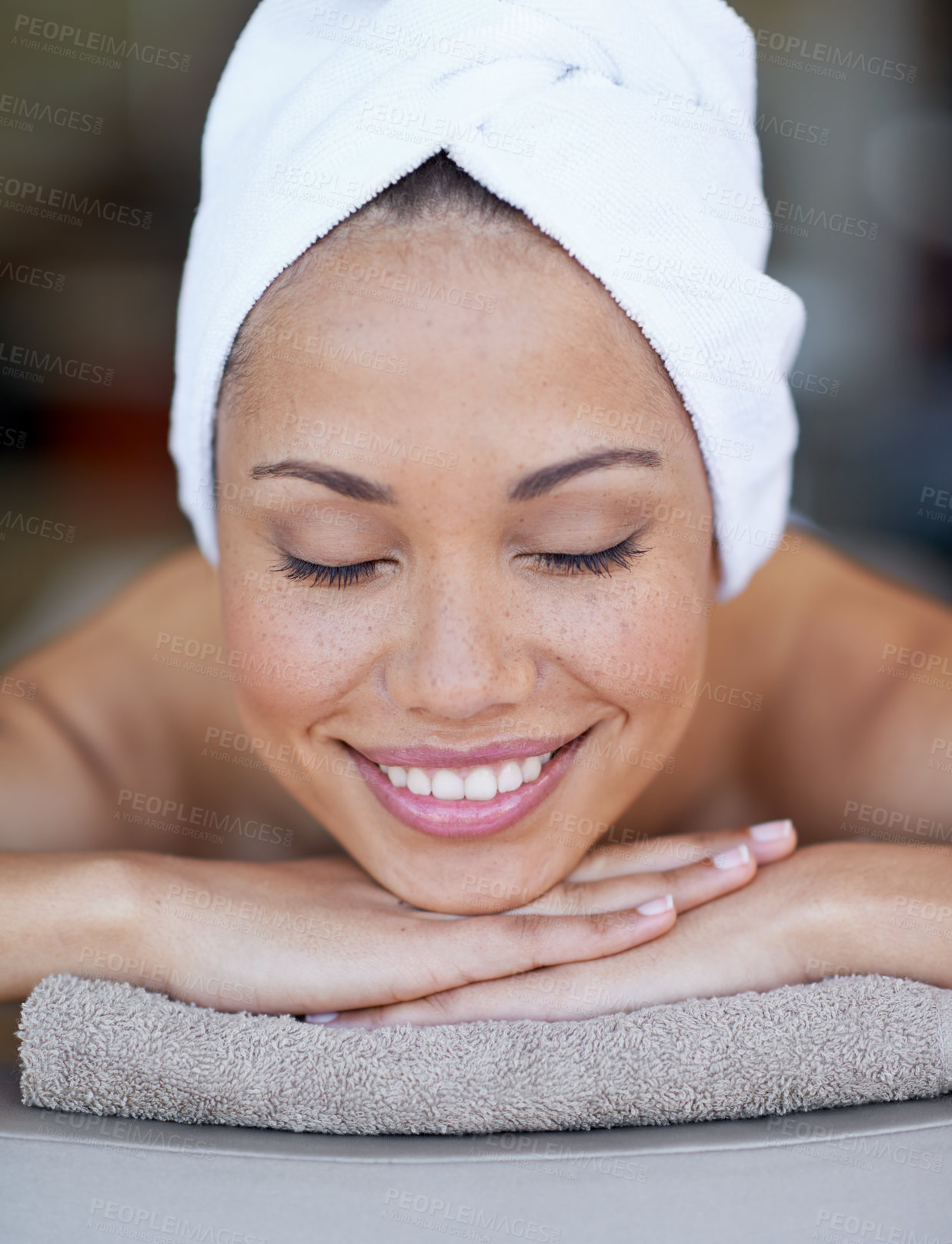 Buy stock photo Spa, woman and relax on massage bed with smile for wellness, zen and beauty treatment for body care. Person, sleeping and physical therapy at resort, salon table and luxury on holiday or vacation