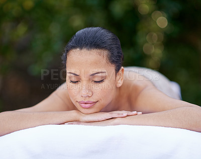 Buy stock photo Spa, woman and relax on massage bed with smile for wellness, zen and beauty treatment for body care. Person, sleeping and stress relief at resort, salon table and peaceful on holiday or vacation