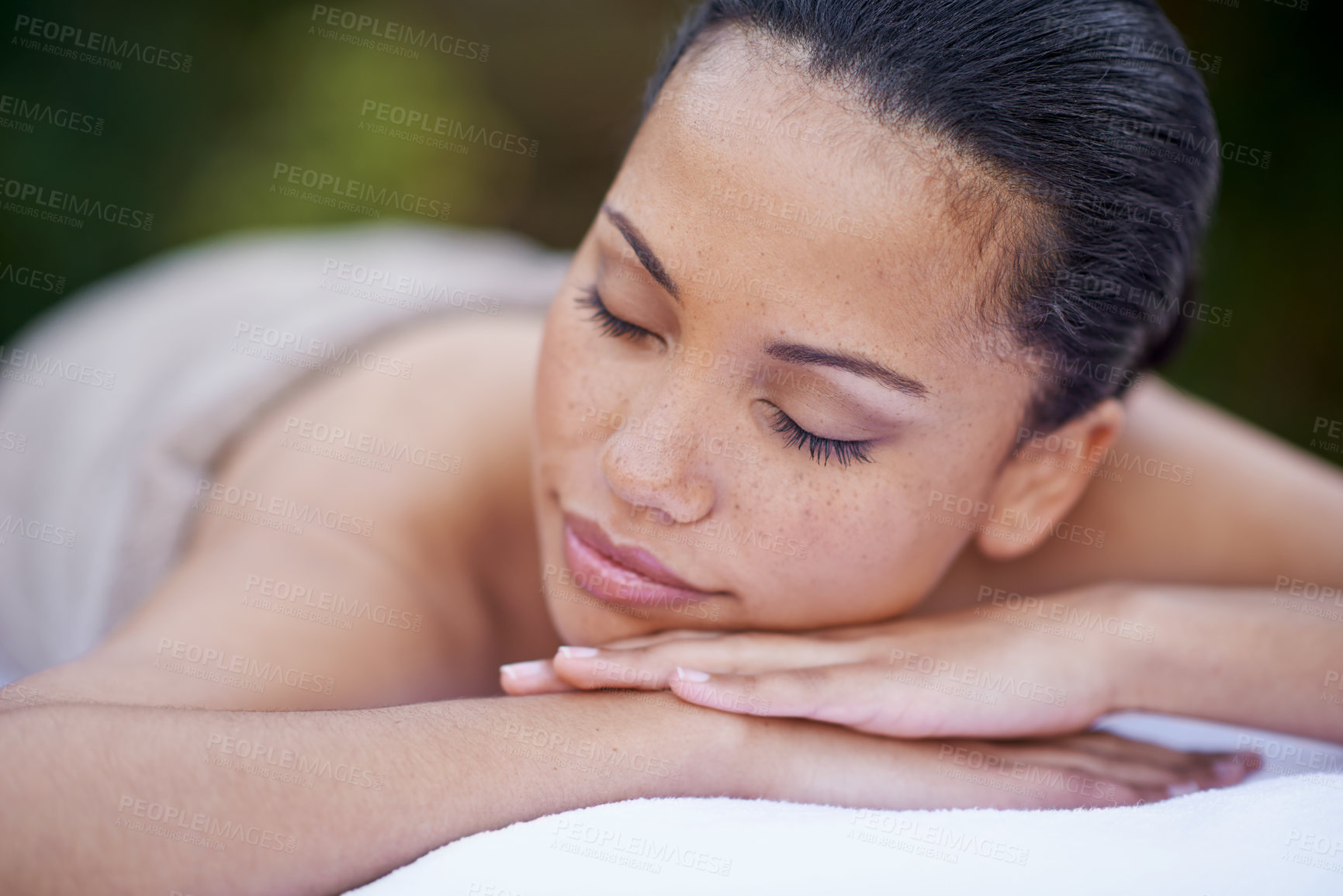 Buy stock photo Sleep, relax and a woman on a spa bed for a massage, luxury relaxation and wellbeing in nature. Relax, calm and a young lady sleeping after a skin treatment, pampering and wellness in a garden