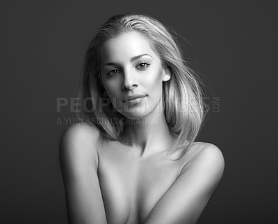 Buy stock photo Black and white portrait of an attractive young woman posing topless in studio