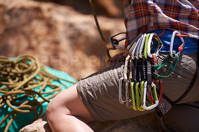 Buy stock photo Person, harness and gear on mountain for rock climbing with safety equipment on waist in nature. Closeup of hiker or climber with rope, strap or cable hooks for trekking, fitness or extreme sports