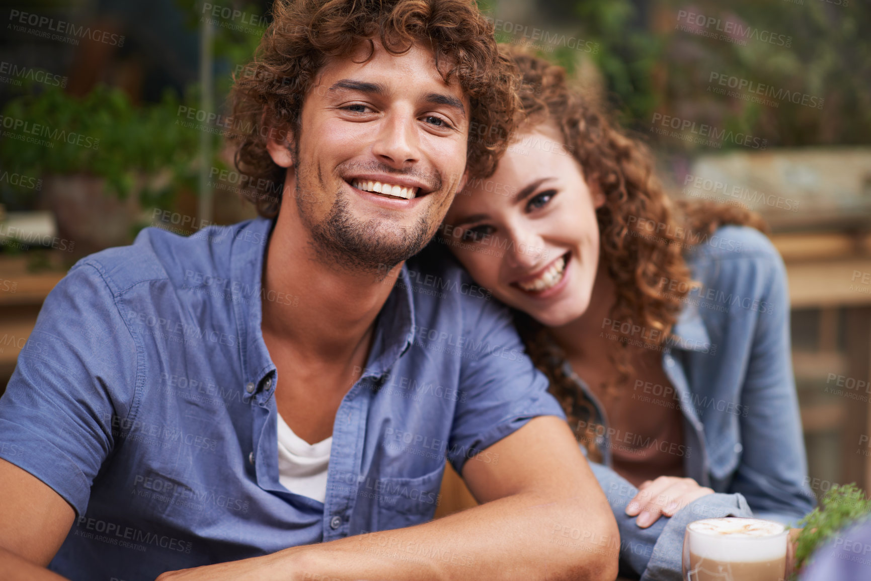 Buy stock photo Happy, love and portrait of couple at coffee shop on romantic, anniversary or morning date. Smile, positive and young man and woman bonding at cafeteria or restaurant for cappuccino together.