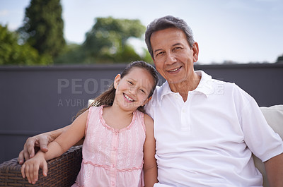 Buy stock photo A young girl and her grandfather spending time together