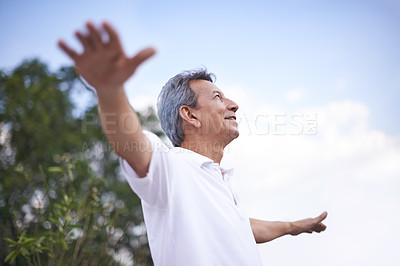 Buy stock photo Mature man, freedom and thinking in outdoors, relax and daydreaming in countryside or park. Happy male person, profile and fresh air for mindfulness on holiday or vacation, peace and travel in nature