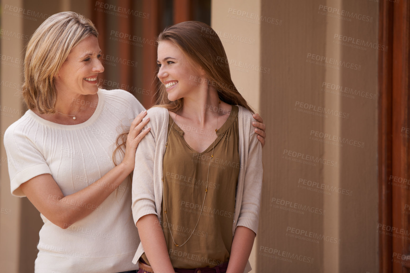 Buy stock photo Women, mother and daughter with conversation, support and happy for advice, bonding and care at house. People, girl and mature mom with talking, love or connection with smile at family home in France