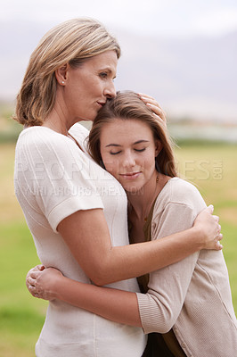 Buy stock photo Mother, daughter and hug with care outdoors in nature for mothers day, love and affection for gratitude. Mom, teenage child and bonding together on summer vacation for support, smile and relationship