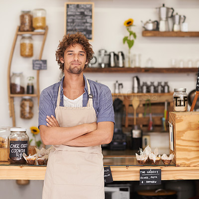 Buy stock photo Portrait of a male barista standing happily at a cafe counter