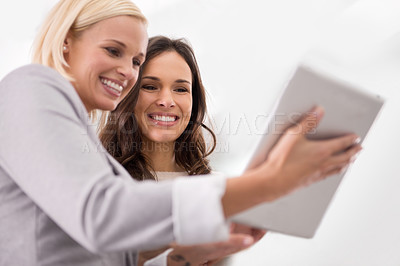 Buy stock photo Meeting, discussion and business women on tablet in office for planning, email and research project. Corporate team, collaboration and people on digital tech for website, internet and online report