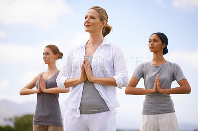 Buy stock photo Women doing yoga outdoors