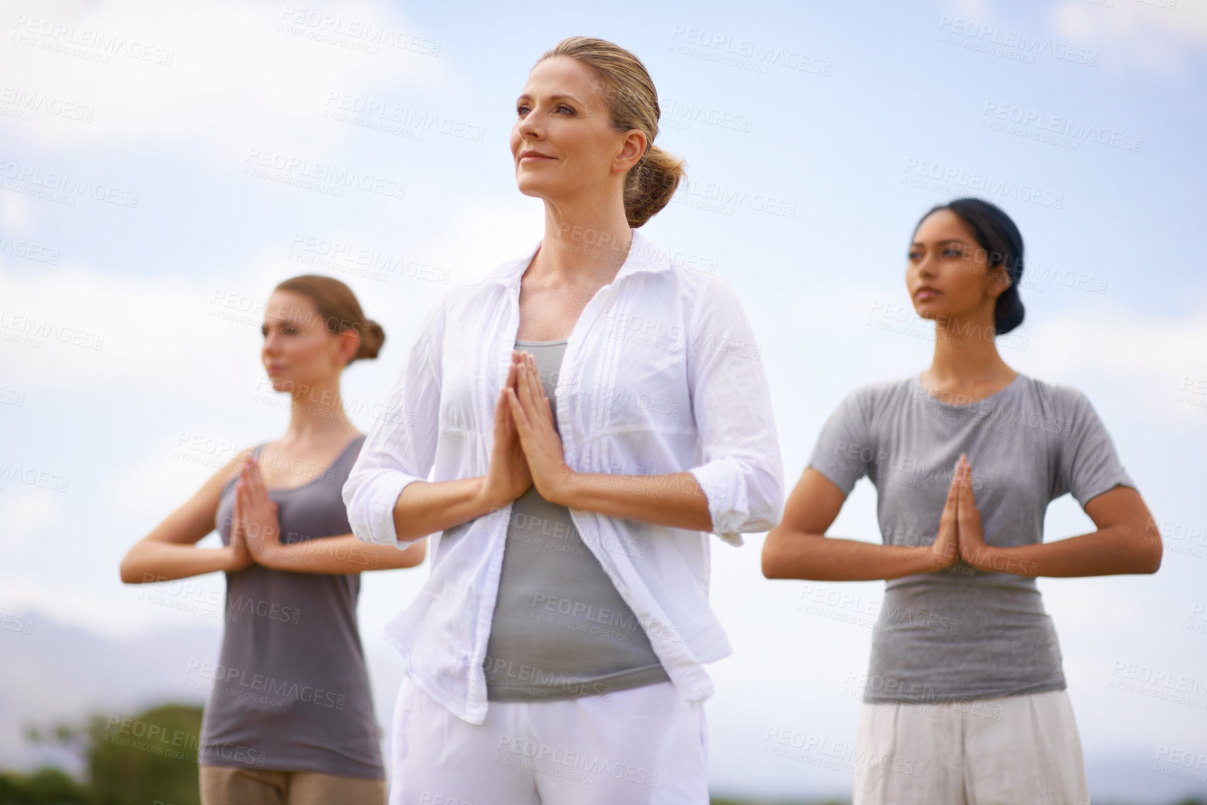 Buy stock photo Women doing yoga outdoors