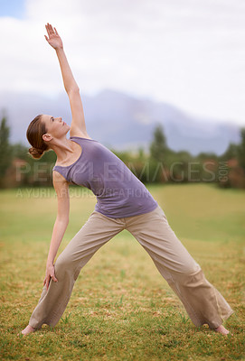 Buy stock photo Woman, yoga and pilates on field in nature for outdoor workout, exercise or health and wellness. Young female person or yogi stretching body for zen, training or balance in wellbeing on green grass