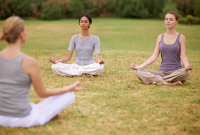 Buy stock photo Lotus, group and meditation outdoor for yoga, healthy body and mindfulness exercise to relax. Peace, zen and calm women in padmasana in nature for balance, spirituality or breathing with instructor