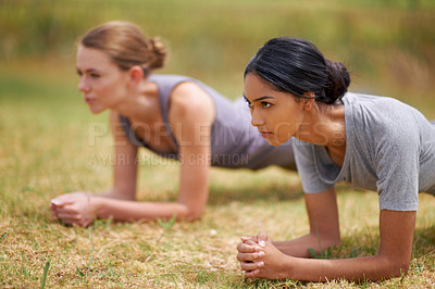 Buy stock photo Woman, friends and plank in fitness for core strength, exercise or outdoor workout on field in nature. Young female person or team in ab training for muscle, stamina or endurance  on green grass