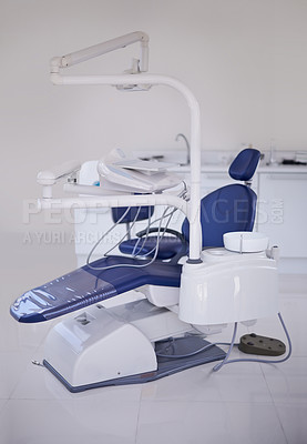 Buy stock photo Dental, chair and healthcare at dentist office, medical equipment or furniture for oral health and wellness. Orthodontics, dentistry and treatment workspace for mouth care at orthodontist clinic