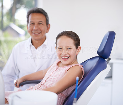 Buy stock photo Portrait, dentist and man with child in clinic for expert advice, confidence and orthodontics in medical health. Dental medicine, healthcare and professional with girl patient, smile and oral service