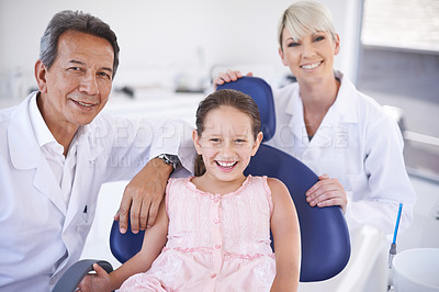 Buy stock photo Portrait of a dentist and his assistant with their patient