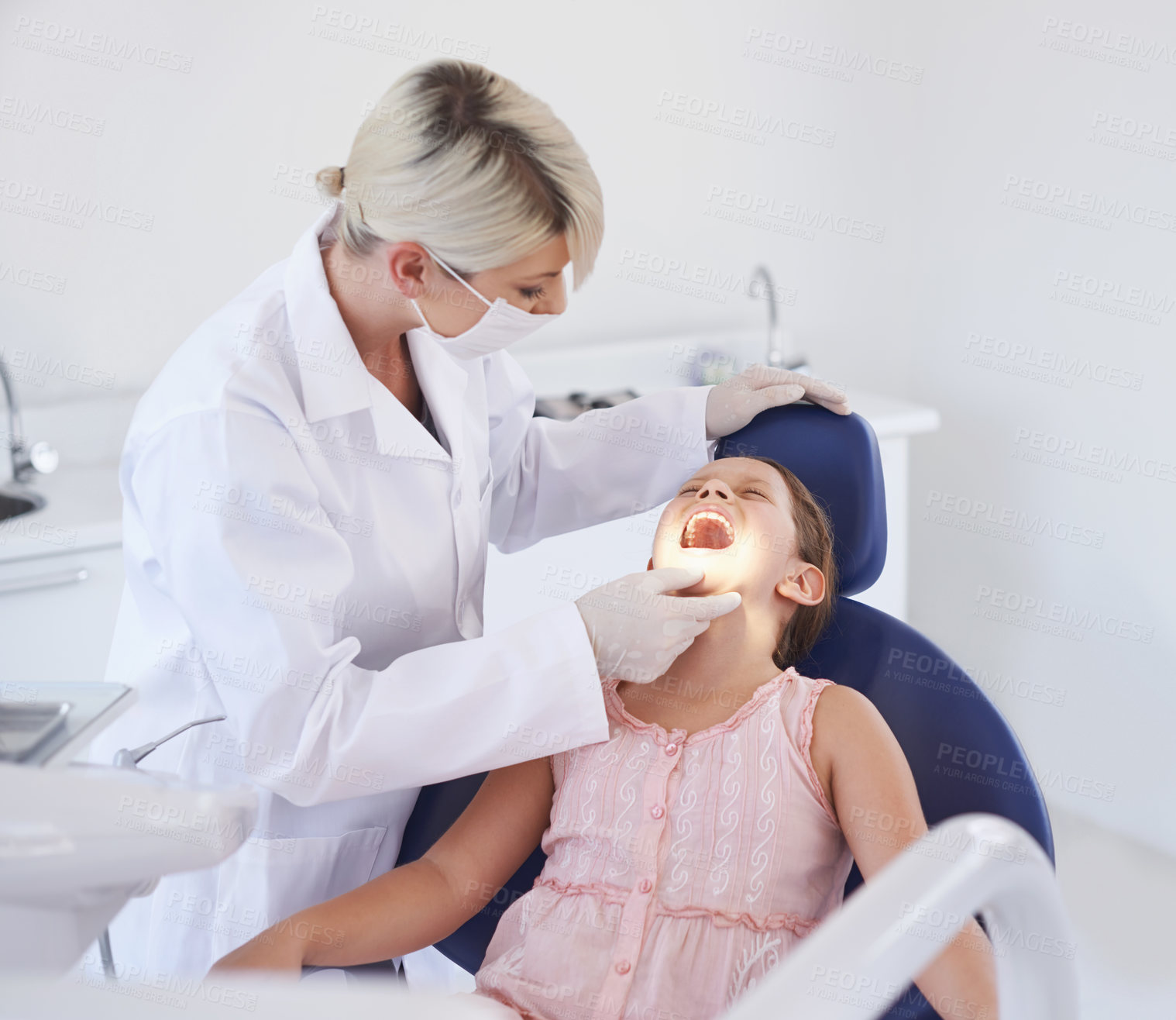 Buy stock photo Girl, child and dentist with consultation for healthcare, gum disease and dental hygiene with mouth inspection. Medical, orthodontics and professional for teeth health, cleaning or open with wellness