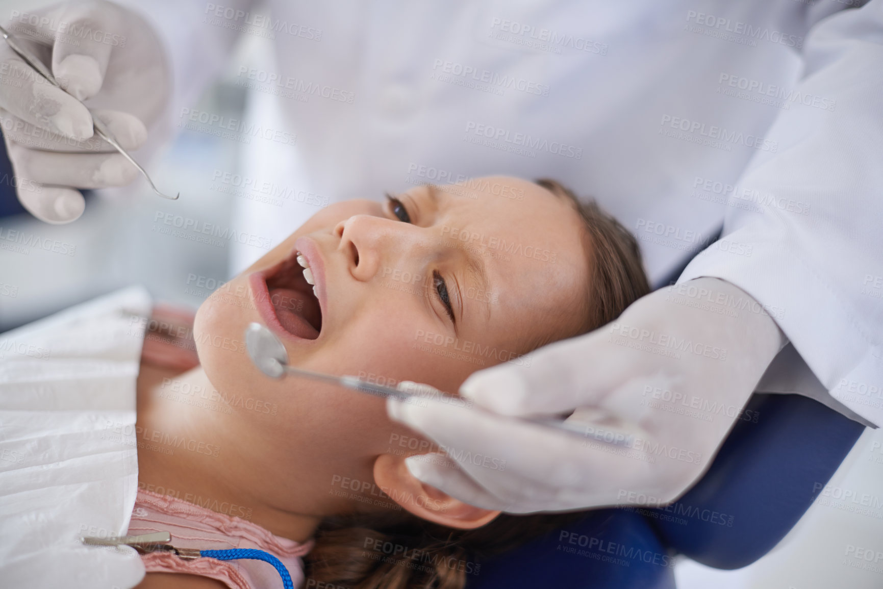 Buy stock photo Crying, child and hands with tools for dental, gum disease and oral hygiene mouth inspection with fear. Dentist, orthodontics and consultation for teeth health, cleaning and wellness with excavator