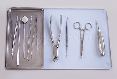 Buy stock photo Top view of tools for dentist, steel and dental for healthcare, procedure or treatment with orthodontics. Oral hygiene, medical equipment for teeth and tray with instruments for dentistry and surgery