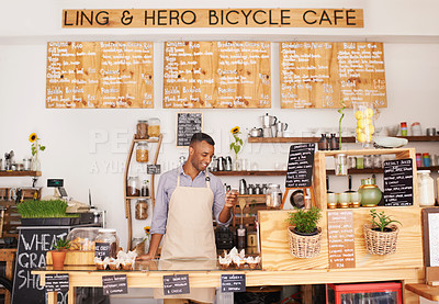Buy stock photo Black man, cafe sign and phone of an entrepreneur with happiness from small business. Coffee shop, mobile and African barista looking on an app with a smile at bakery and restaurant feeling happy