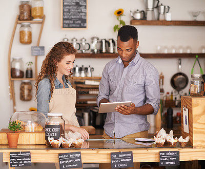 Buy stock photo Shot of two people in a cafe