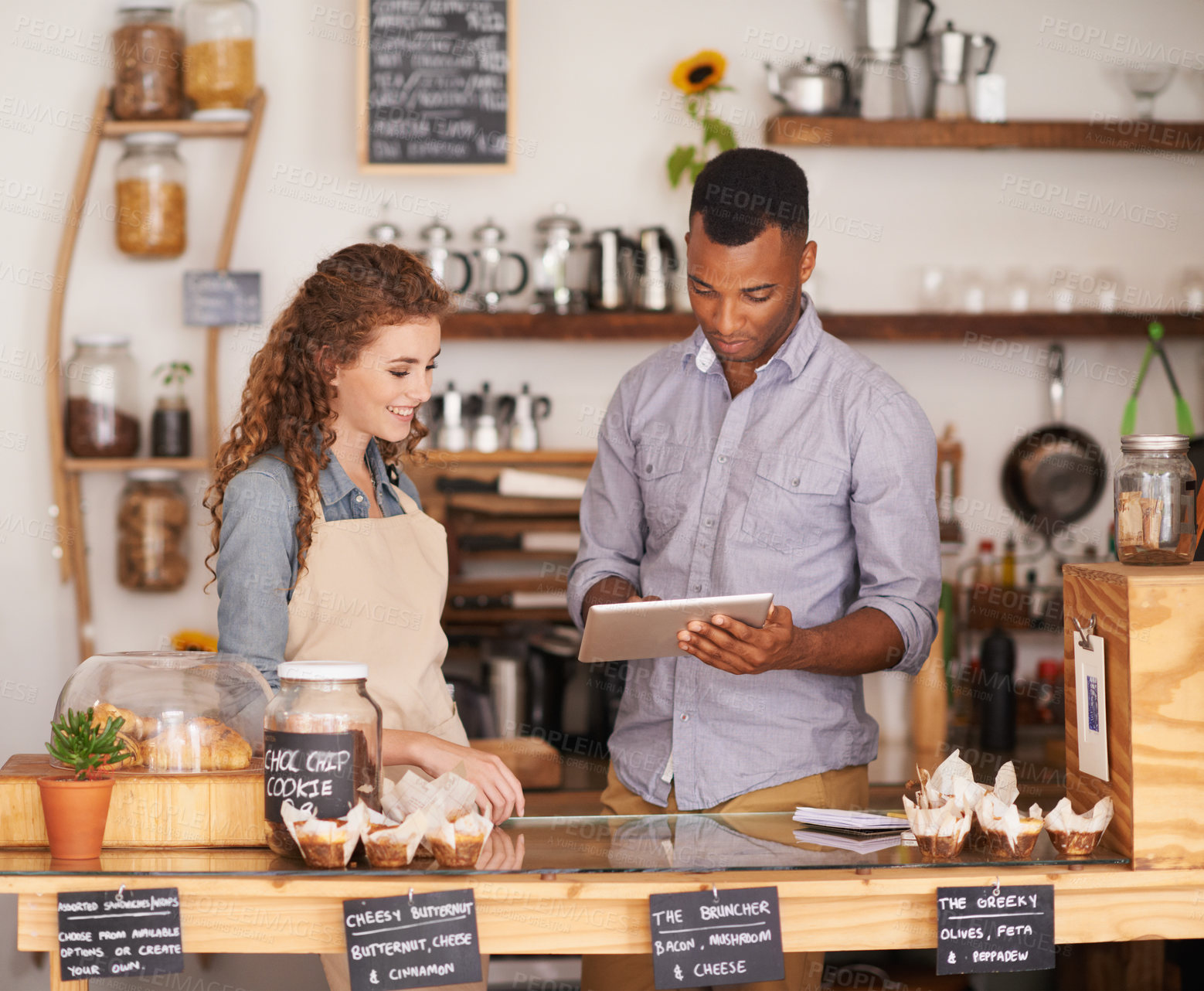 Buy stock photo Shot of two people in a cafe