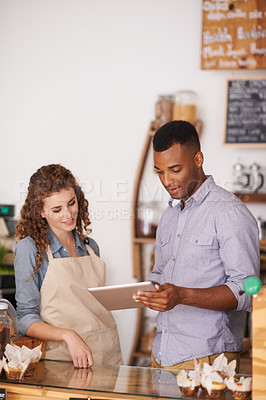 Buy stock photo Tablet, coffee shop and barista teamwork of people in discussion and training in cafe. Waiters, black man and happy woman in restaurant with technology for inventory, stock check or managing sales.