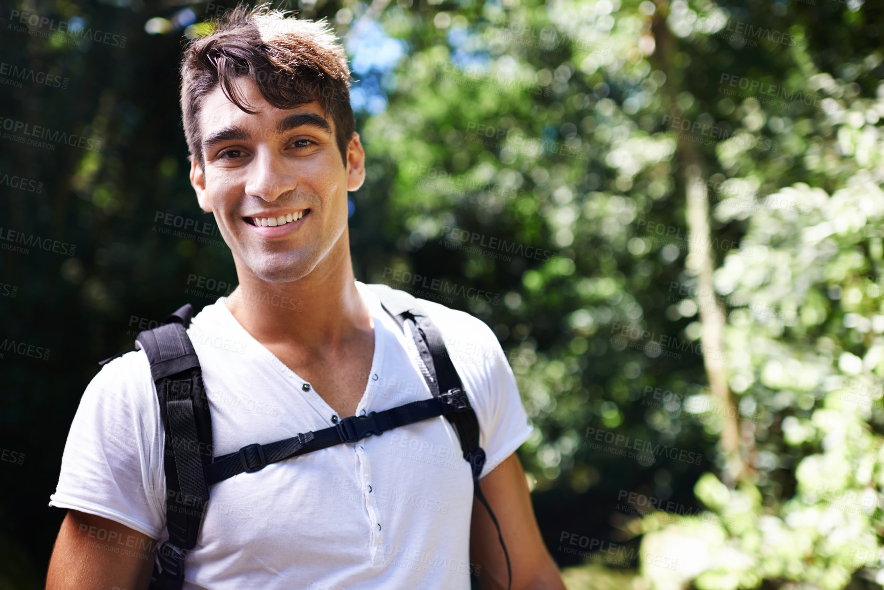 Buy stock photo Man, portrait and backpack for hiking in rainforest with smile for adventure, holiday and outdoor in summer. Person, happy and bag for trekking, walk and journey in nature for  vacation in Colombia