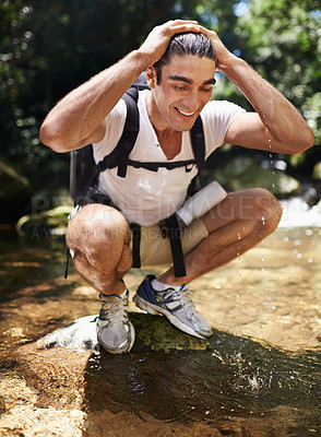 Buy stock photo Travel, trekking and wet man by water for adventure, vacation or holiday with backpack in Colombia. Nature, forest and young male person hiking with bag by lake for refresh in woods on weekend trip.