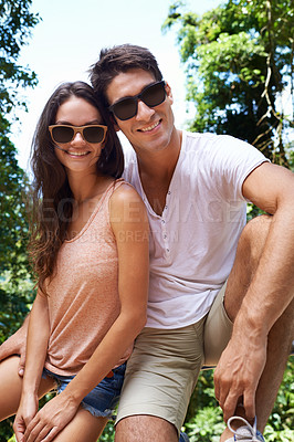 Buy stock photo Happy, nature and portrait of couple in forest for bonding, relationship and relax together. Sunglasses, dating and man and woman hiking on holiday, vacation and weekend for travel, wellness and love