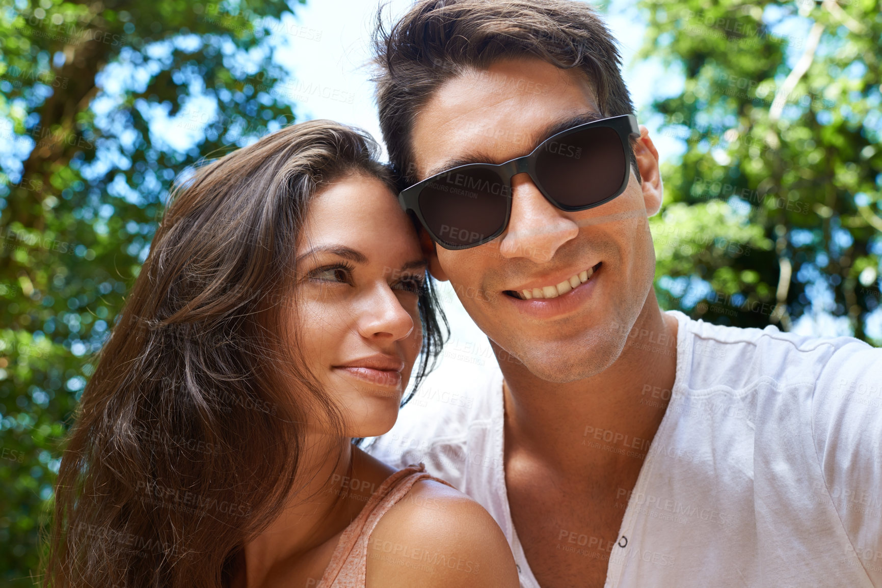 Buy stock photo Happy, love and portrait of couple in park for bonding, relationship and relax outdoors together. Nature, dating and man and woman on holiday, vacation and weekend for travel, wellness and adventure