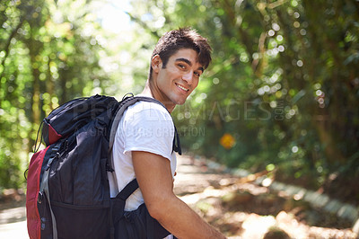 Buy stock photo Man, portrait and backpack for hiking in jungle with smile for adventure, holiday and outdoor in summer. Person, happy and bag for trekking, walk and journey in rainforest for vacation in Colombia