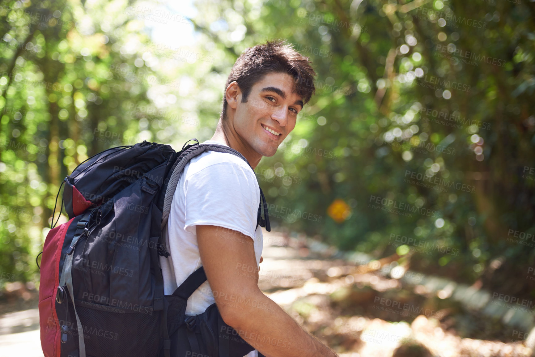 Buy stock photo Man, portrait and backpack for hiking in jungle with smile for adventure, holiday and outdoor in summer. Person, happy and bag for trekking, walk and journey in rainforest for vacation in Colombia