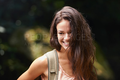 Buy stock photo Hiking, backpack or happy woman in nature, woods or wilderness for trekking or outdoor adventure with bag. Smile, relax or hiker walking in natural park or forest for exercise or wellness on holiday
