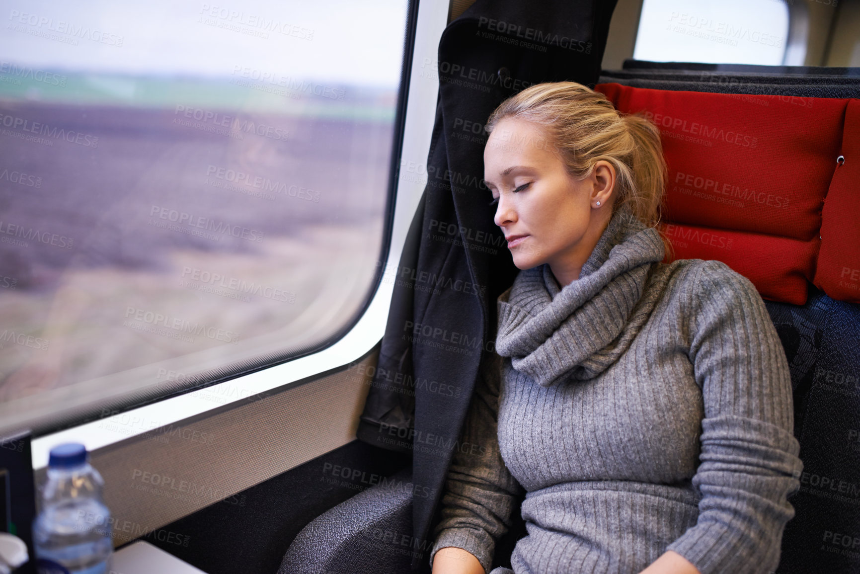Buy stock photo Woman, train and sleep with travel or relax journey for holiday destination for tired, transportation or resting. Female person, window and commute in Canada with nap for peace, comfortable or trip