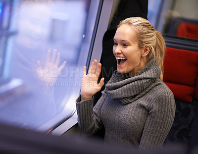 Buy stock photo Happy, wave and woman in train for travel, commute and journey for holiday, vacation and tourism. Excited, hand gesture and person by window on railway, metro and public transportation for adventure