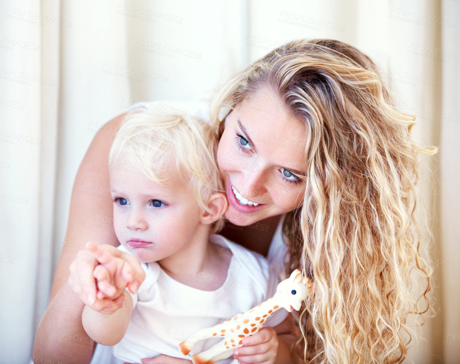 Buy stock photo Cropped shot of an affectionate young mother with her baby boy