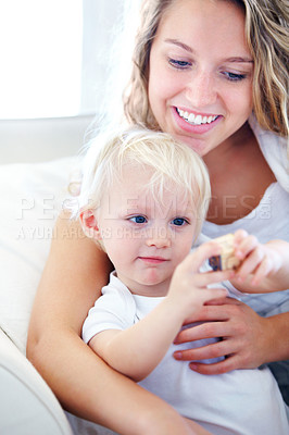 Buy stock photo Mom, toddler and together with love on sofa for bonding, learning and relax with safety for kid. Single mother, child and support with toy blocks for growth, development and happy in home on couch