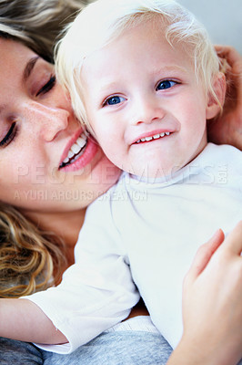 Buy stock photo Cropped shot of an affectionate young mother with her baby boy