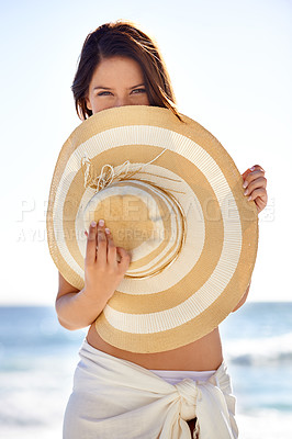 Buy stock photo Woman, portrait and hat on beach for travel, holiday and vacation in Maldives in summer with relax and confidence. Person, tourist and face with beachwear outdoor in nature for adventure and getaway 
