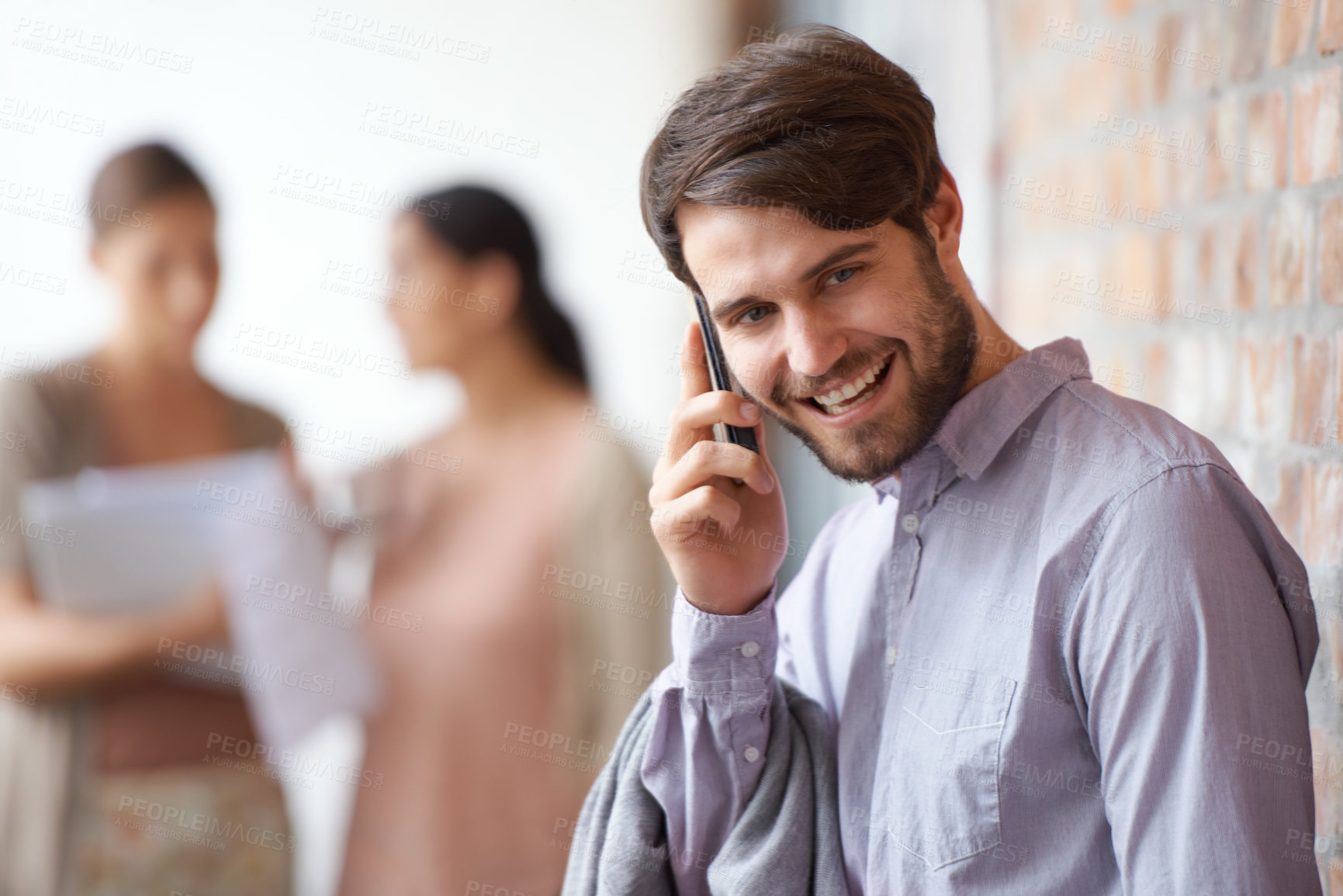 Buy stock photo Project, happy or businessman on a phone call talking, networking or speaking of ideas in office. Wall, mobile communication or male entrepreneur with smile, deal or contact for negotiation offer