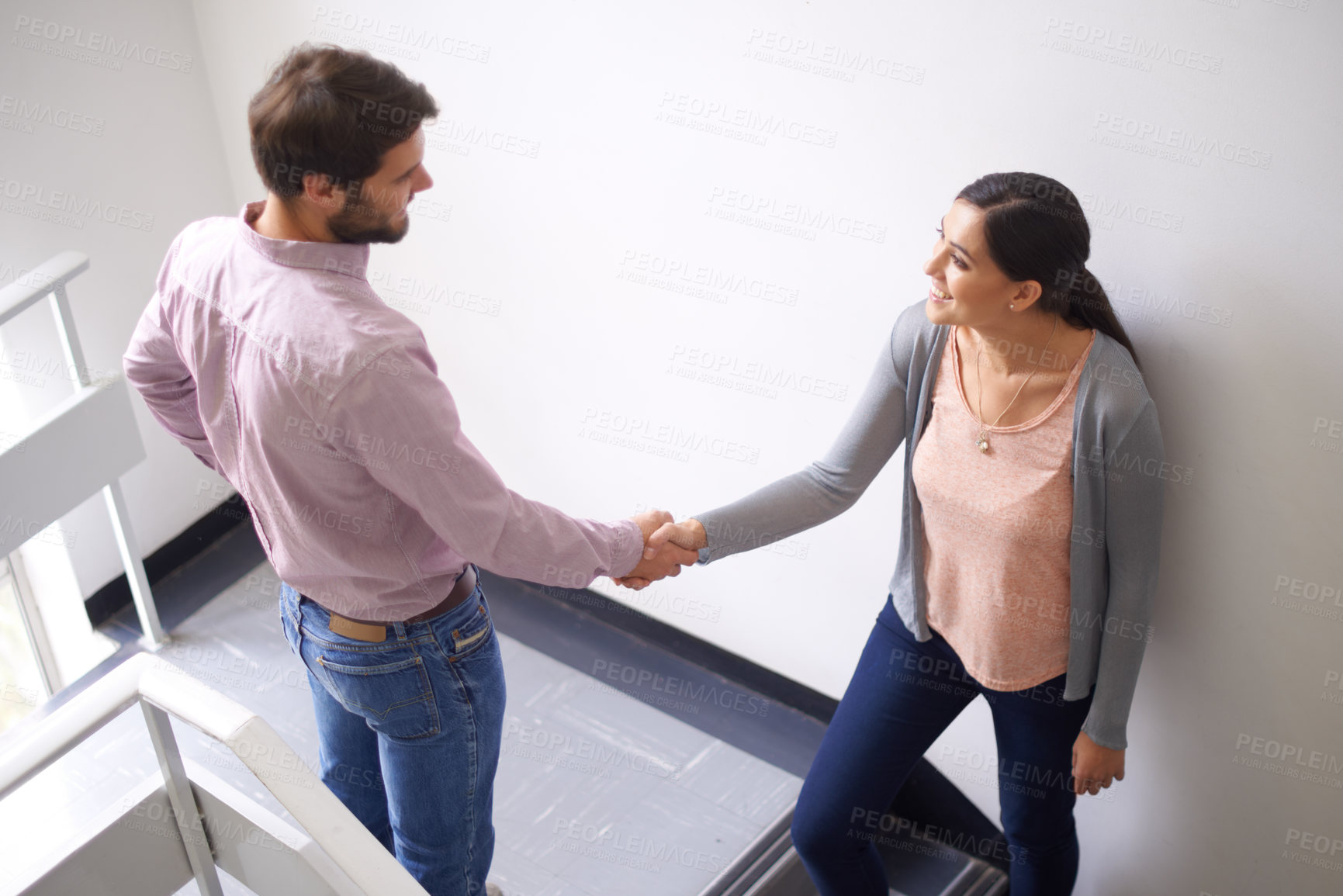 Buy stock photo Man, woman and shaking hands for office partnership with collaboration in stairwell for deal, agreement or introduction. Colleagues, business and recruitment in Canada or teamwork, career or greeting