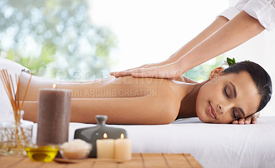Buy stock photo Happy woman, relax and back massage at spa for skincare, beauty or zen at hotel or resort. Calm female person or model lying on bed with masseuse hands in relaxation for stress relief or treatment