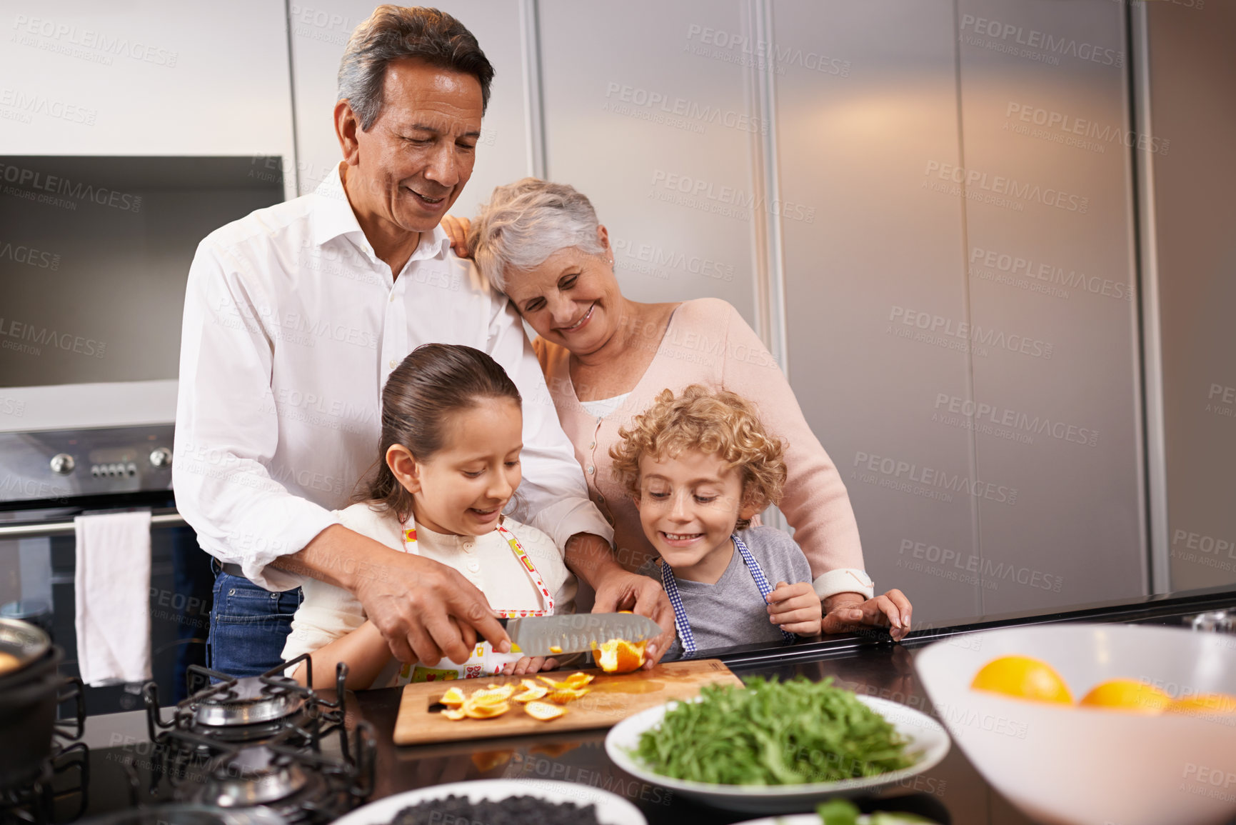 Buy stock photo Food, grandparents or happy children learning cooking skills for a healthy dinner with fruit or vegetables at home. Teaching kids, knife or grandmother with old man or diet meal nutrition in kitchen