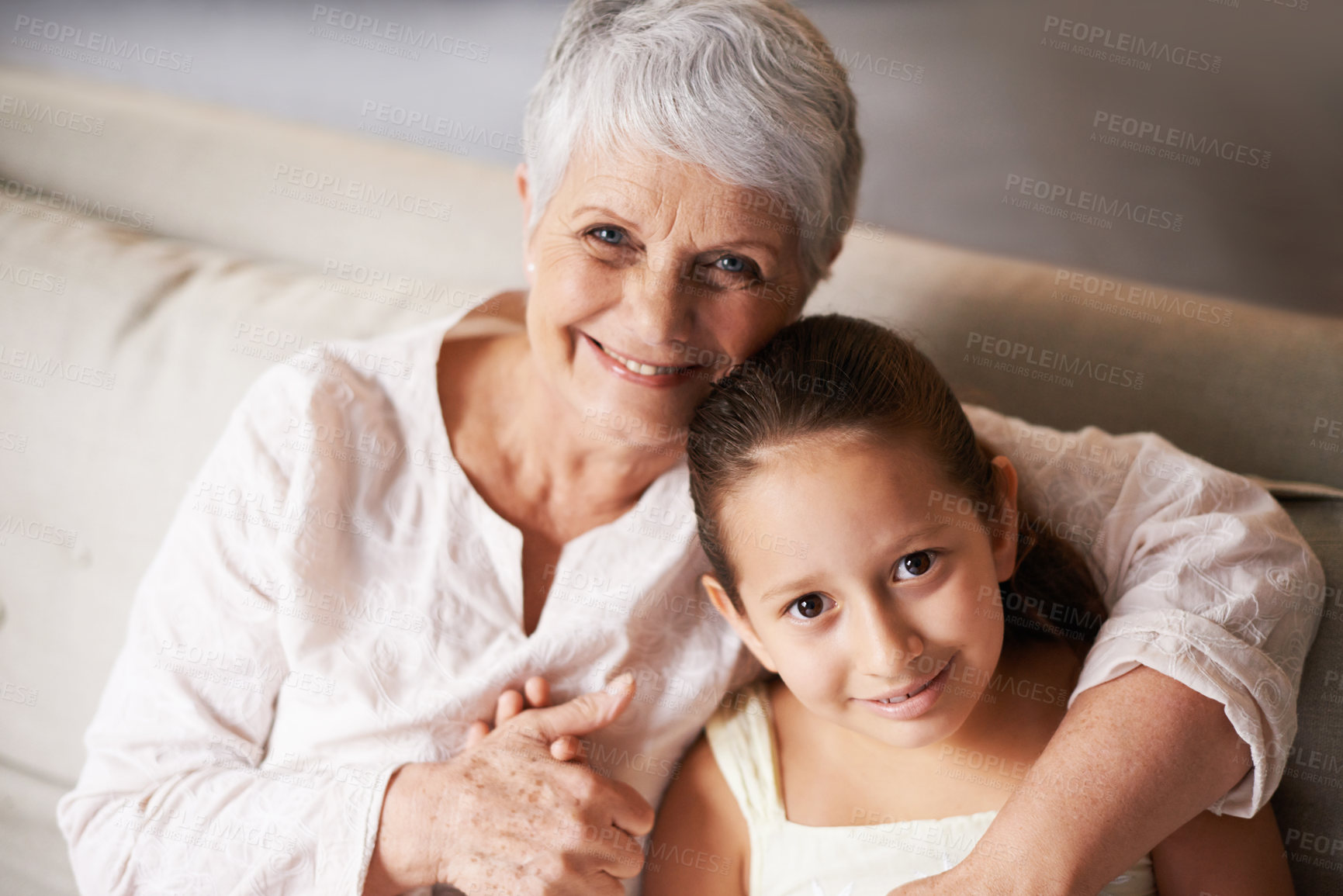 Buy stock photo Portrait, smile or grandma hugging a happy girl with love in family home on holiday break together. Child, embrace or elderly grandmother relaxing or bonding to enjoy quality time in retirement 