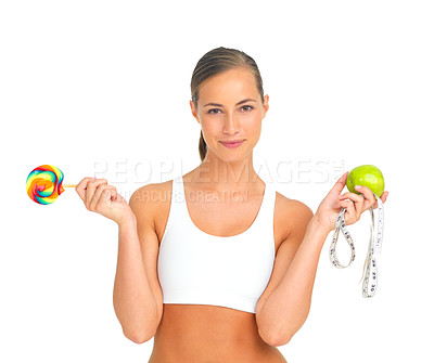Buy stock photo Lollipop, apple and fitness choice of woman in studio isolated on a white background. Face portrait, healthy diet decision and young female model holding candy, fruit vitamins and measuring tape.