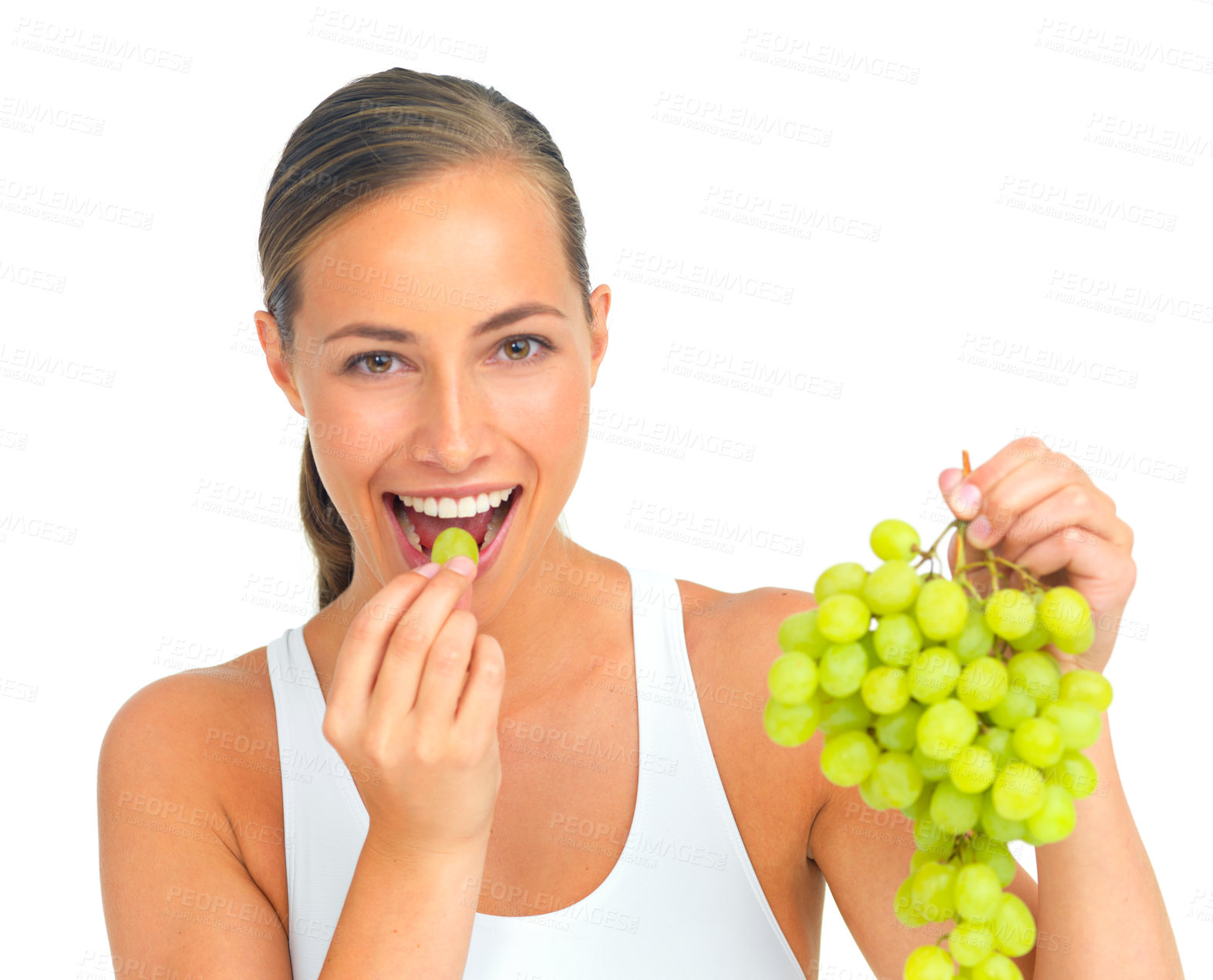 Buy stock photo Health, diet and woman with grapes in a studio for a healthy snack, nutrition or craving. Wellness, weightloss and portrait of a young female model eating fruit while isolated by a white background.