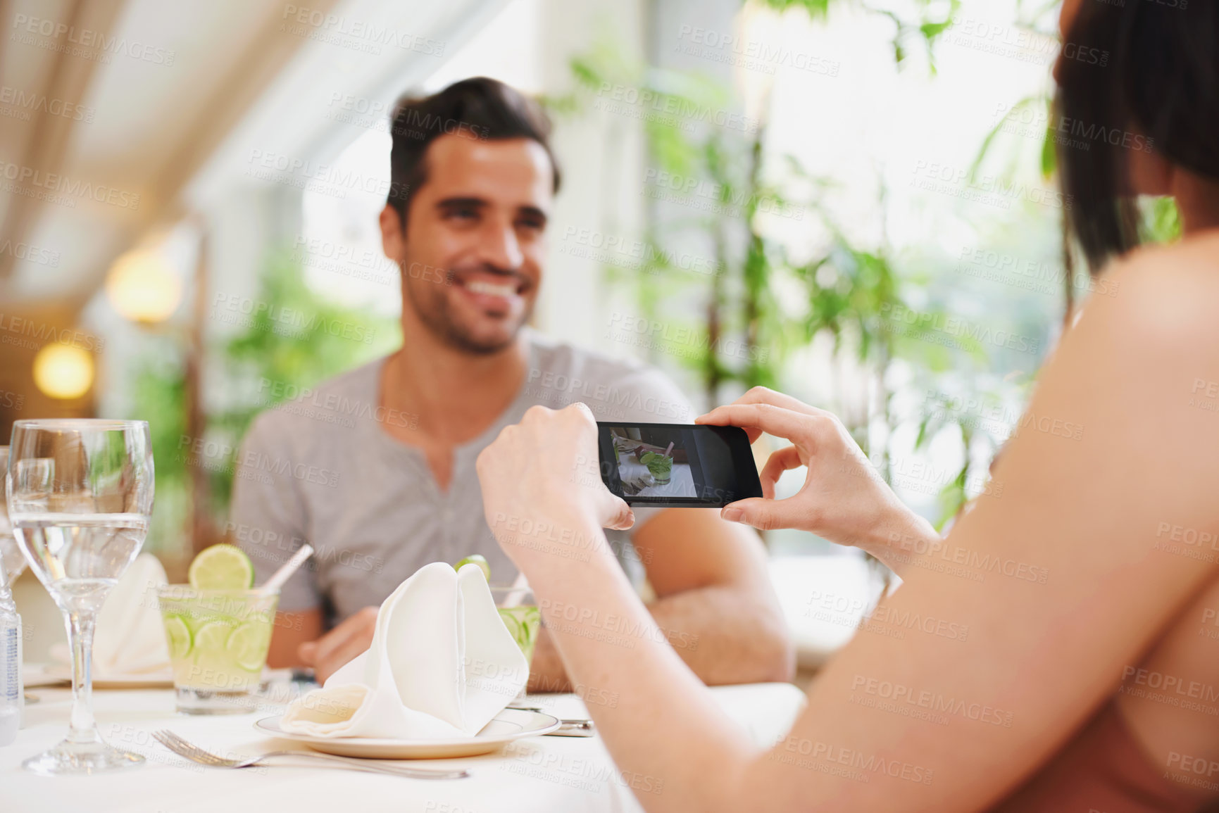 Buy stock photo Restaurant, man and woman taking picture, food and lunch with digital app and social media. People, cafe and couple with smartphone or photograph with influencer and love with Valentines day or happy