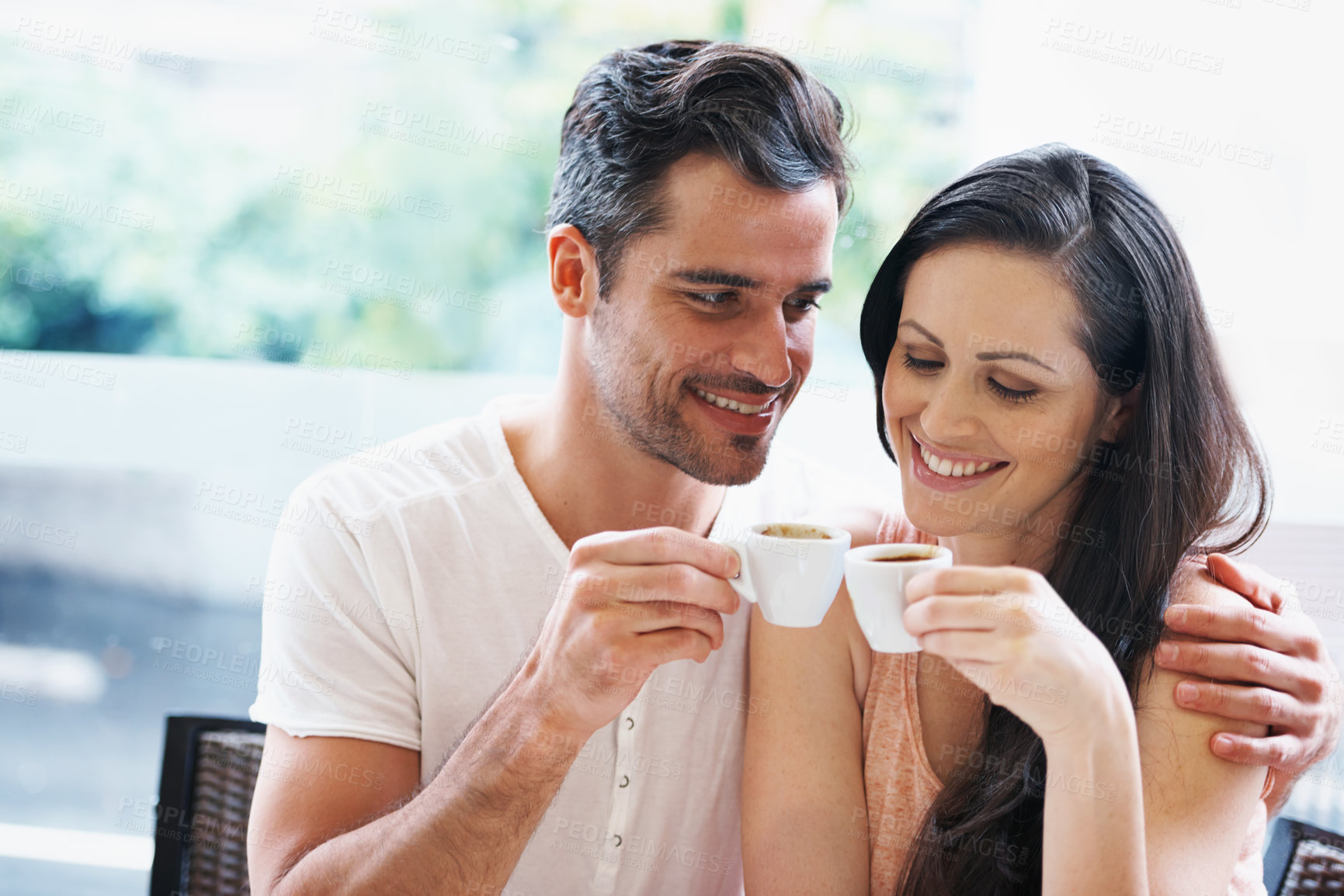 Buy stock photo Date, coffee and couple at cafe with hug, smile and love together with toast and hot drink at a table. Espresso, calm morning and marriage at a restaurant with bonding, care and romance on patio