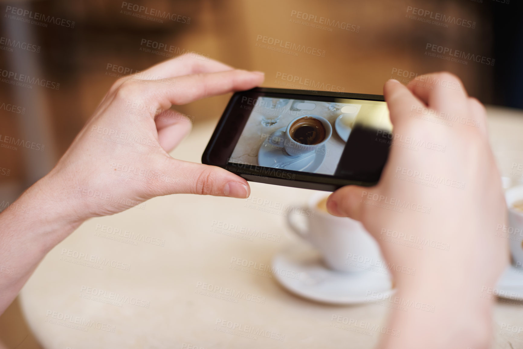 Buy stock photo Cellphone, hands and photography of coffee in restaurant and online to review a cappuccino. Person, mobile app and post of espresso for social media followers and influencer with drink in close up